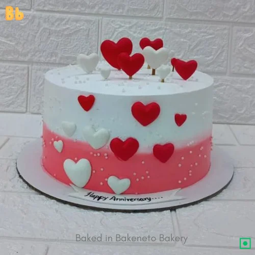 cute pink and white heart shaped cake for valentines day theme. Order cake online by bakeneto.com best design for wedding anniversary cake