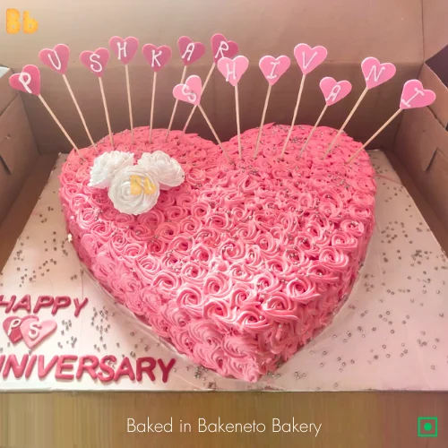 cute pink and white heart shaped cake for valentines day theme. Order cake online by bakeneto.com