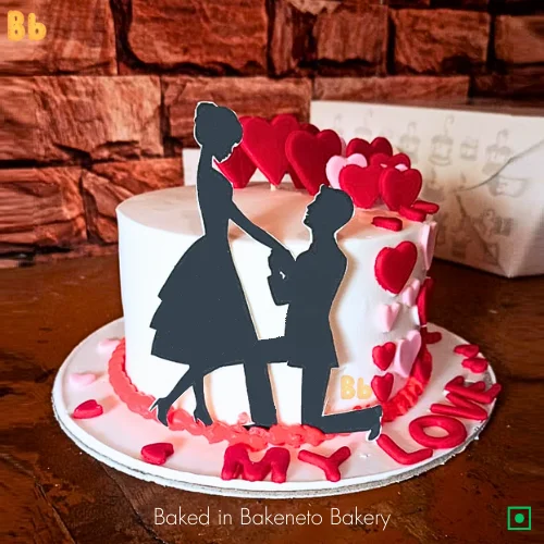 best anniversary cake design and A beautiful couple cake. Boy proposing on his knees and you can also book this cake on her birthday. Fondant customized Heart Cake is in trend to start your love journey. You can Order cakes online in Noida, Indirapuram and Gaur City Noida Extension by bakeneto.com